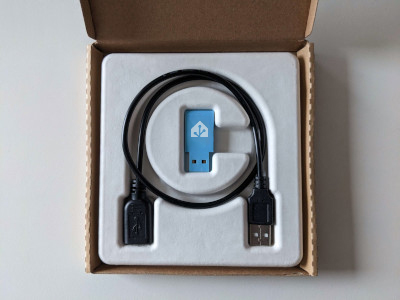 Image showing the Assistant Connect&nbsp;ZBT-1 with the USB extension cable in the original packaging