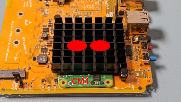 Image showing where to press on the heat sink to press it into place